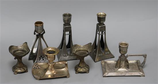 A pair of squat Secessionist candlesticks, two candle holders and three others, the majority WMF